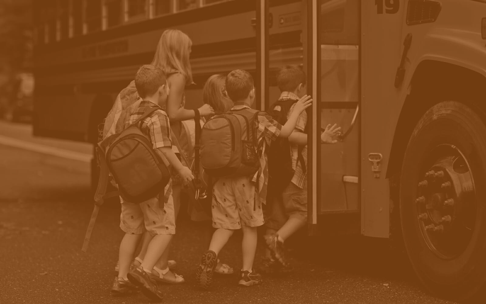 children getting onto a school bus, school bus safety