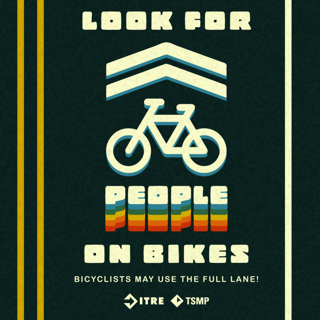 Graphic depicts a lane on a two-way road with a symbol that shows a bicycle capped by a pair of arrows that guide cyclists which way to go. Text reads “Look for people on bikes. Bicyclists may use the full lane!”