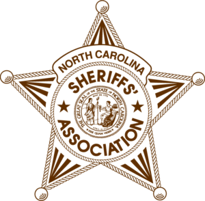 Logo depicts a brown sheriffs badge with text that reads “North Carolina’s Sheriffs’ Association”
